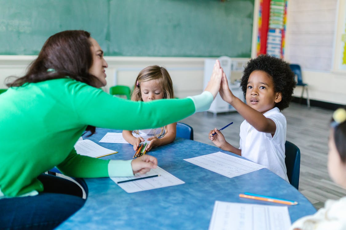 A BCBA working one-on-one with a young child during an ABA therapy session